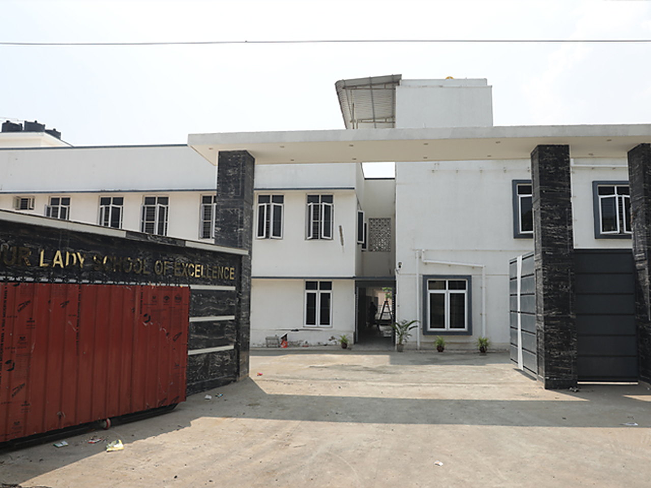 The main entrance of Our Lady School of Excellence, seen from the road