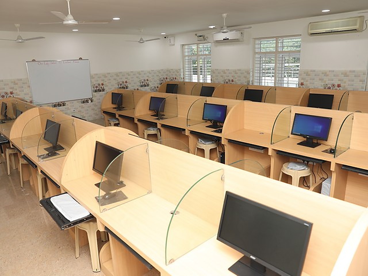 The computer laboratory, a monitor at each partitioned desk