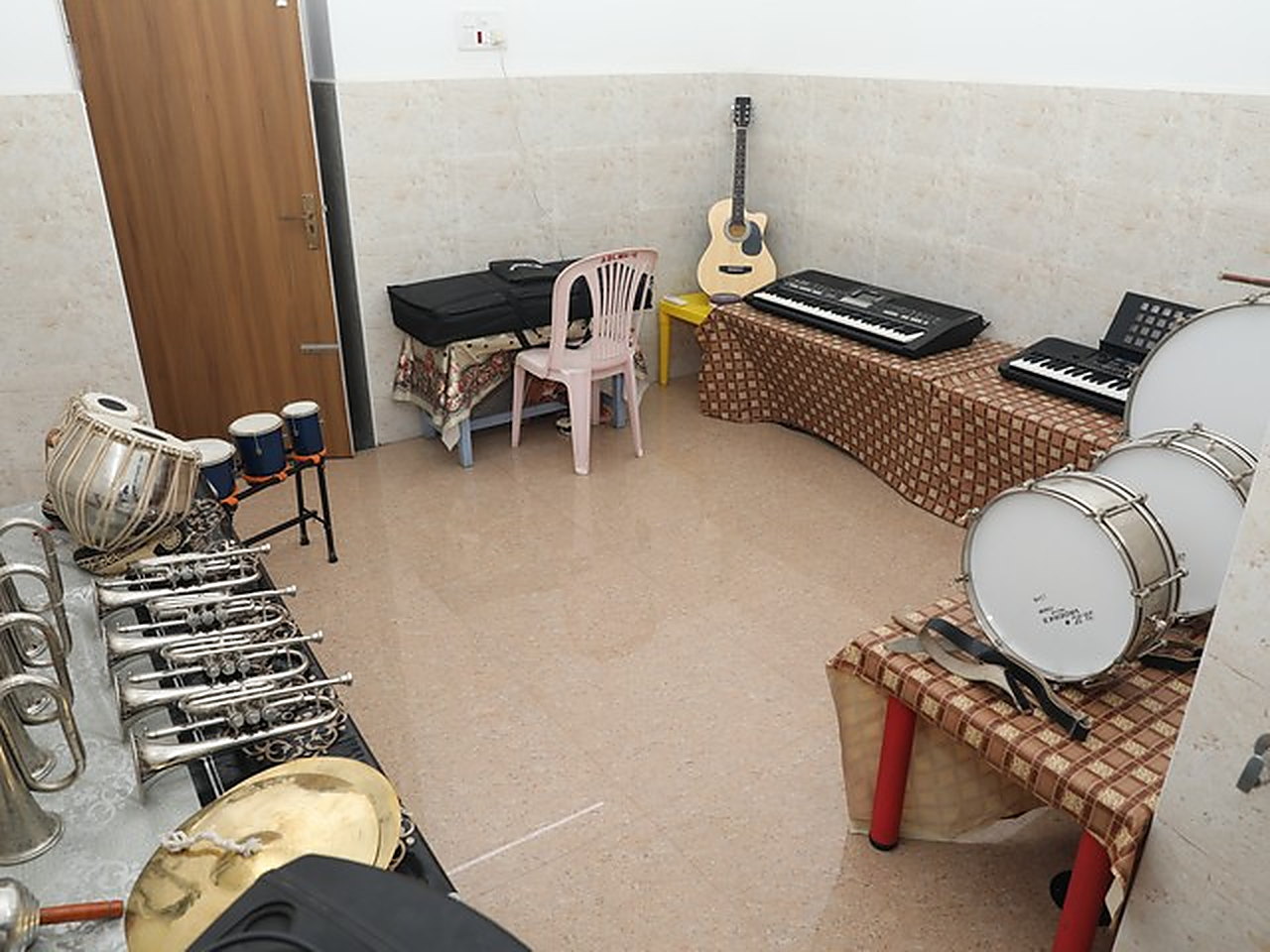 The music room, with keyboards, a guitar and drums